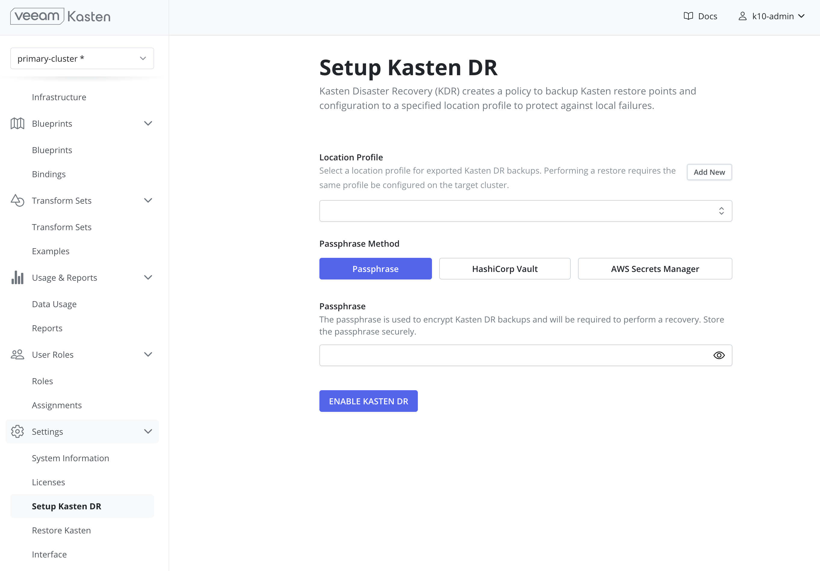The Setup Kasten DR page in the Veeam Kasten dashboard, reached from the Settings section of the navigation sidebar, showing a Location Profile selector with an Add New button, a Passphrase Method choice of Passphrase, HashiCorp Vault, or AWS Secrets Manager, a passphrase field, and an Enable Kasten DR button